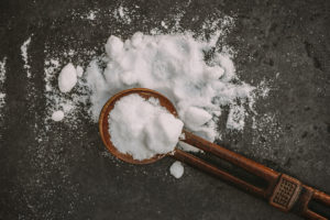 Modern medicines in power form with African wooden spoon